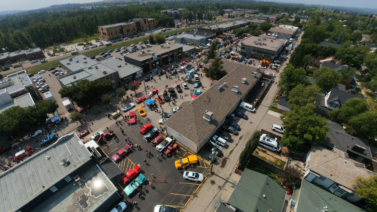 Aerial view of a classic car show filling a main street